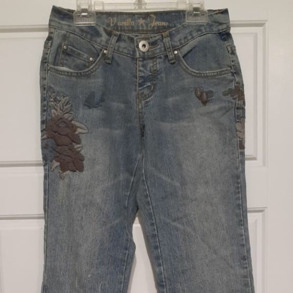 Boot cut jeans with flower on side